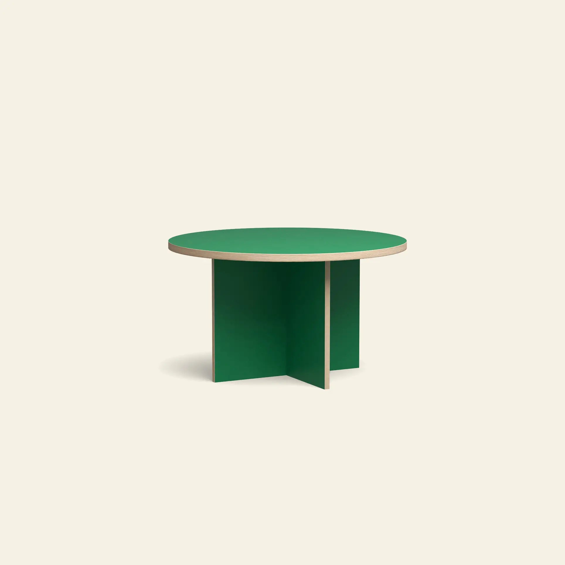 The HKLIVING Dining Table, Round, 130cm features a green top with a light wood edge and a base of two intersecting green panels, shown against a beige background.