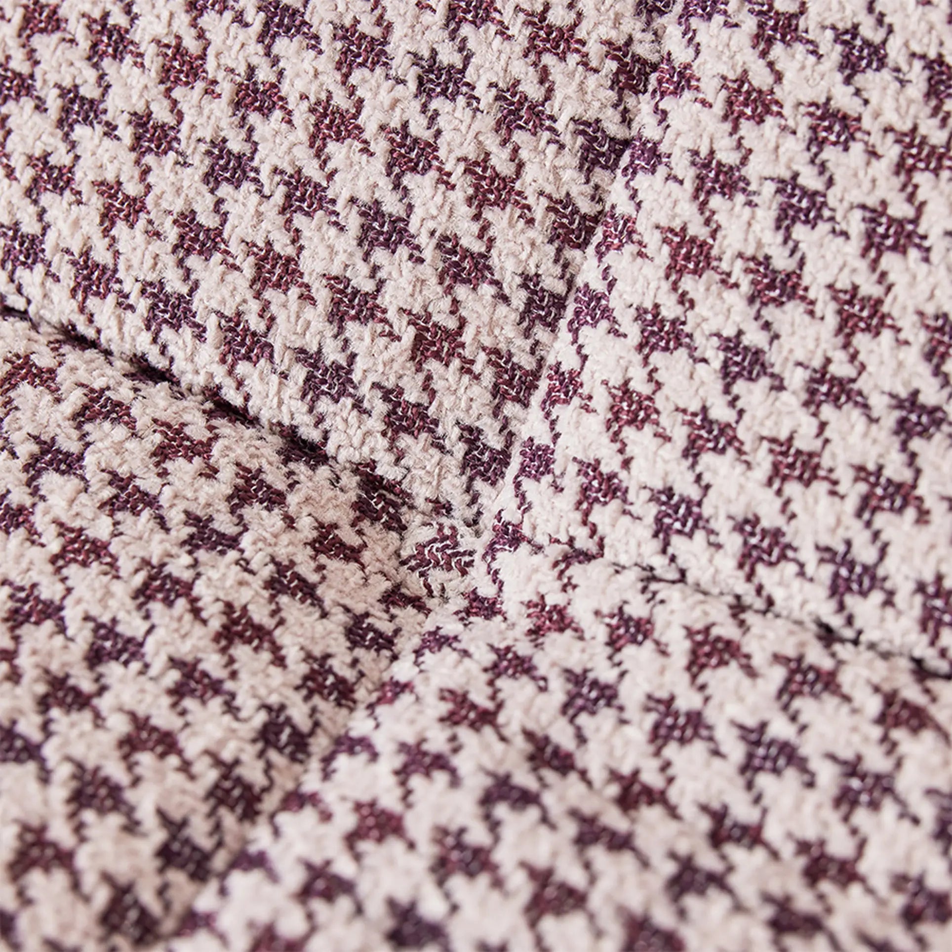 Close-up of the HKLIVING Lazy Lounge Chair by HKLIVING, featuring a cream and burgundy houndstooth fabric that highlights textured seams—perfect for adding comfort and style to any space.