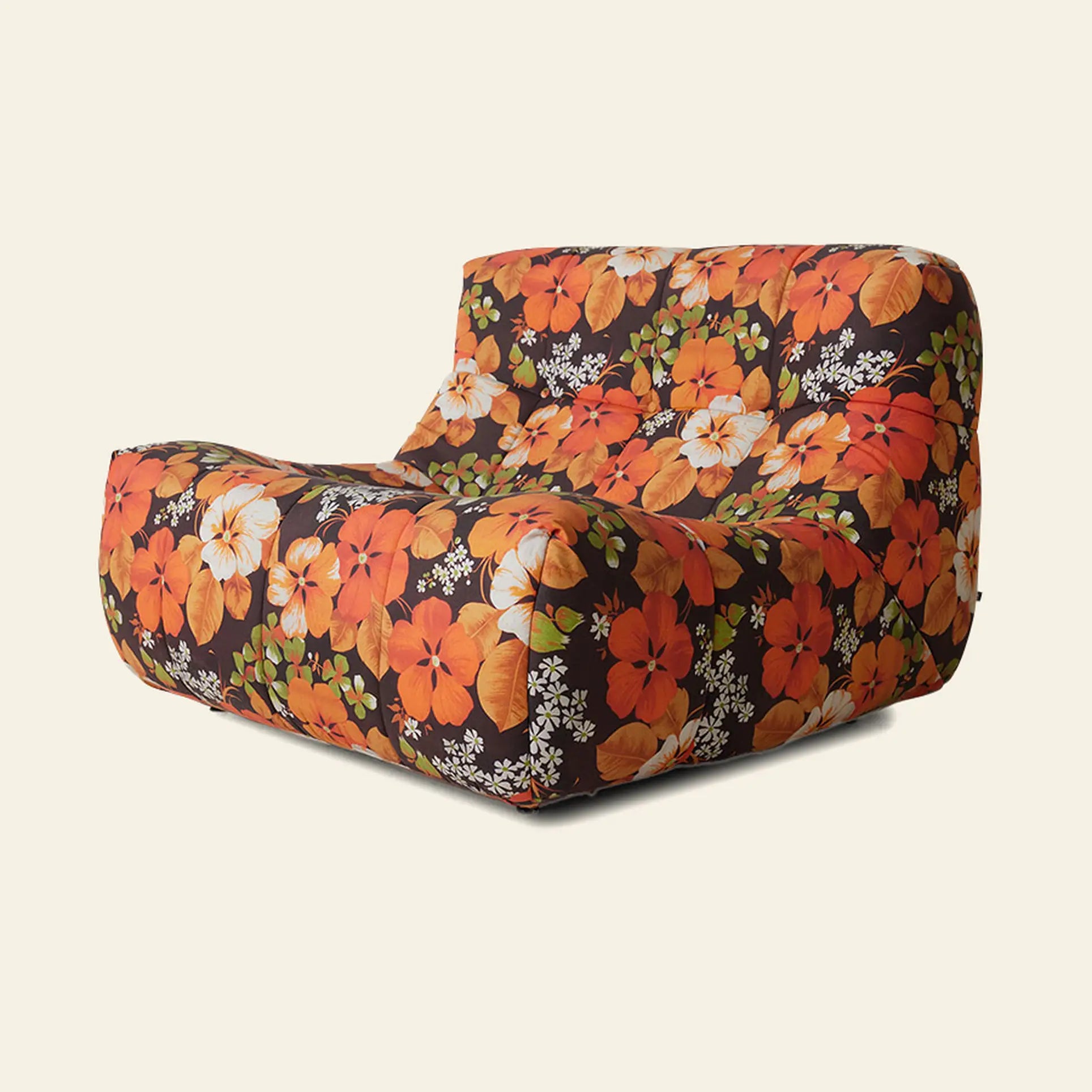 The HKLIVING Lazy Lounge Chair Outdoor by HKLIVING is a modern, low-profile, lightweight chair with no visible legs, upholstered in fabric with a bold floral pattern in orange, red, white flowers and green leaves on a dark background.