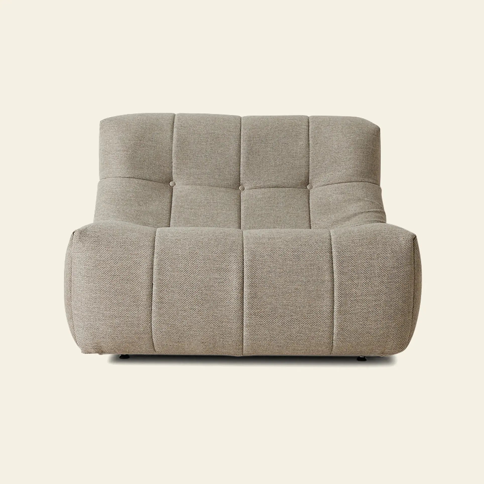 The HKLIVING Lazy Lounge Chair Outdoor by HKLIVING is a modern, armless lounge chair with tufted square sections and textured beige upholstery, featuring a low and wide seat set against a plain light background.