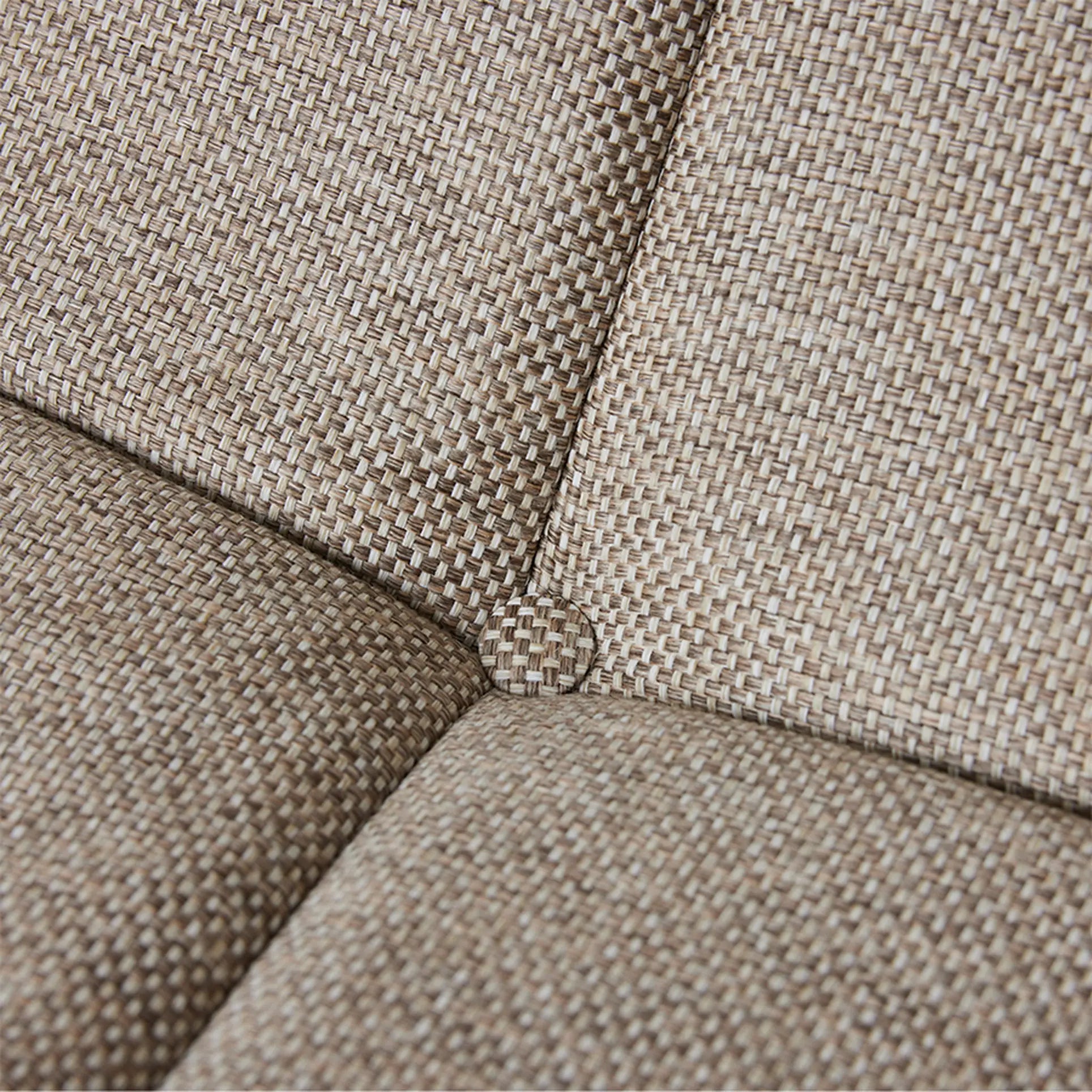 Close-up of the HKLIVING Lazy Lounge Chair Outdoor shows its beige woven fabric cushion, intersecting seams meeting at a central button, and detailed upholstery stitching that highlights HKLIVING's craftsmanship.