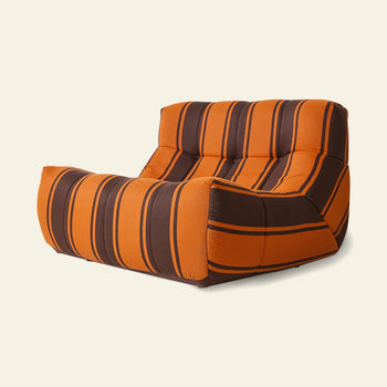 The HKLIVING Lazy Lounge Chair Outdoor by HKLIVING features wide armrests and bold brown and black vertical stripes on orange fabric, set against a plain light background for a modern, cozy look.