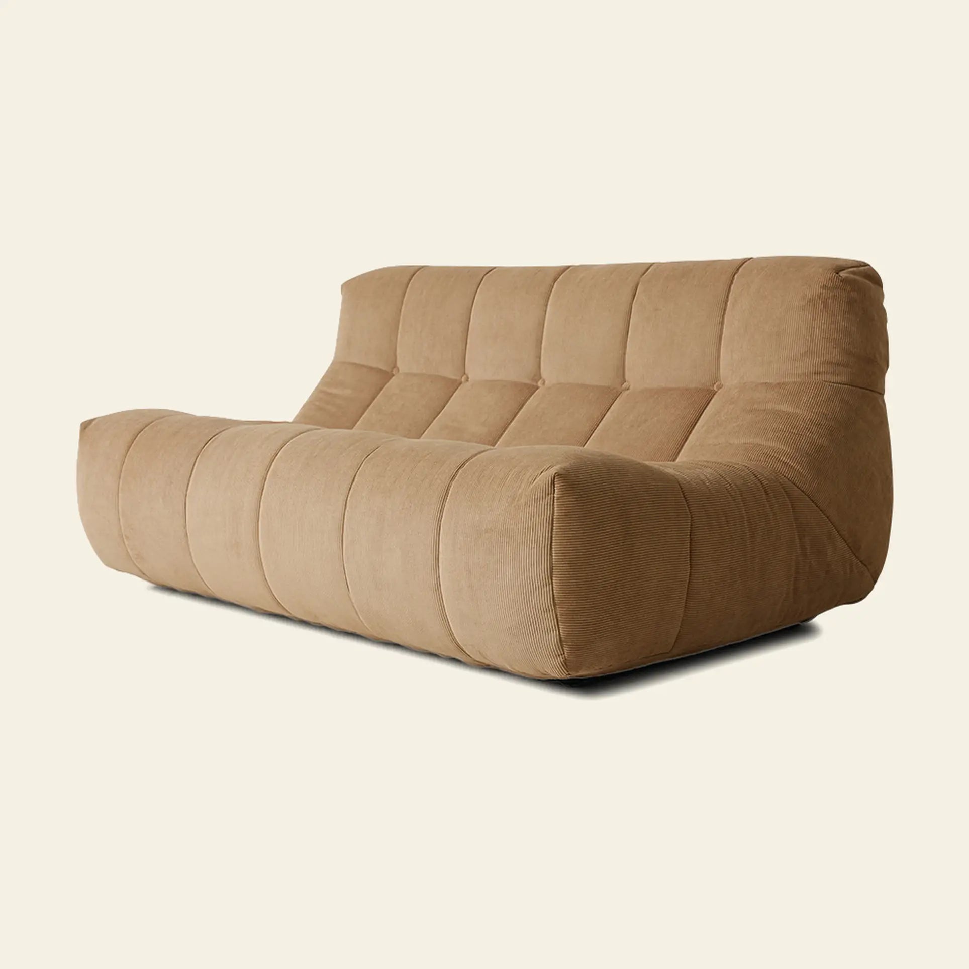 The HKLIVING Lounge Bench Corduroy by HKLIVING is a modern, armless tan bench with a low profile, deep seat, and quilted corduroy upholstery, shown against an off-white background.