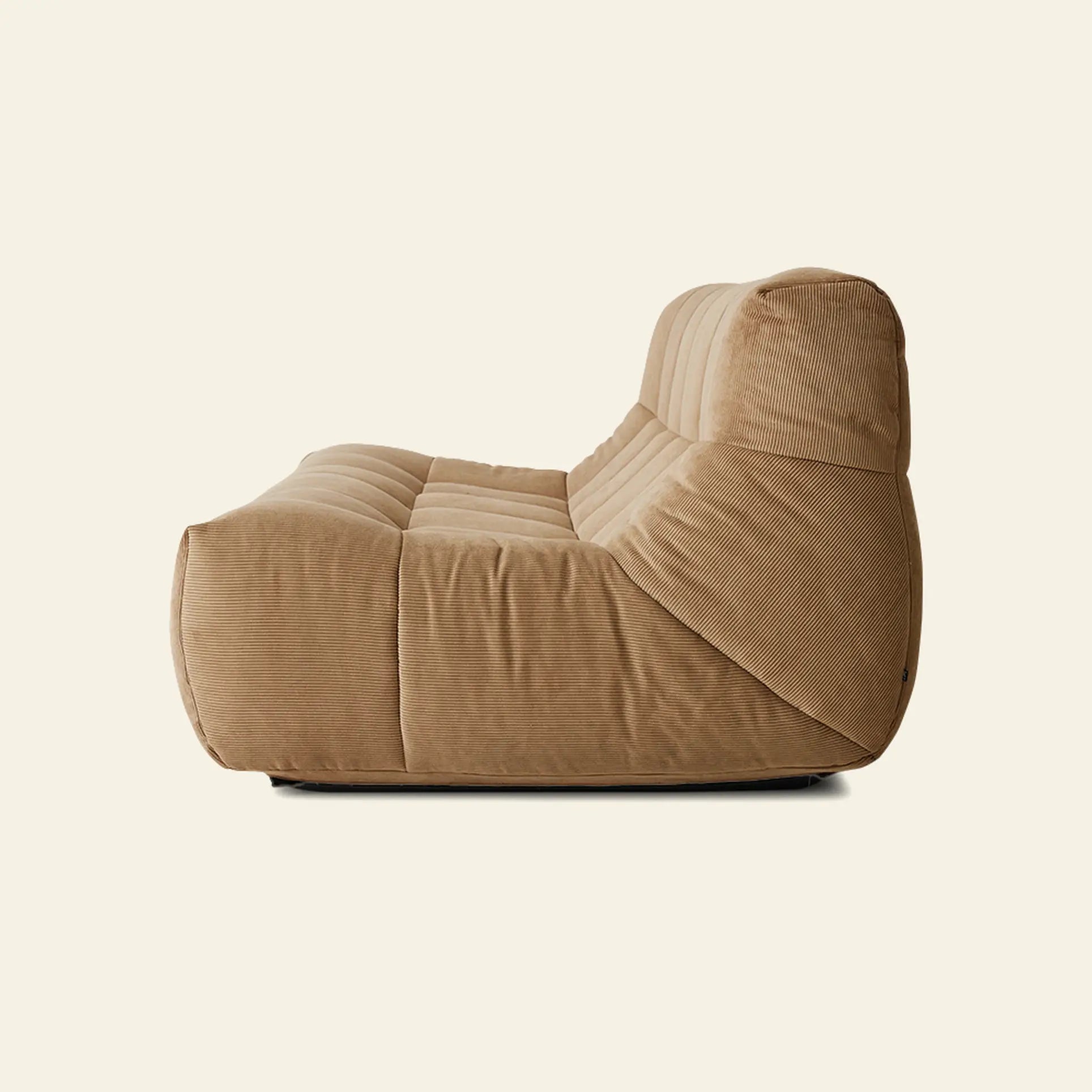 The HKLIVING Lounge Bench Corduroy by HKLIVING is a modern, armless tan lounge bench featuring a low profile and plush cushioned seat and backrest, shown in side view against a plain light background.