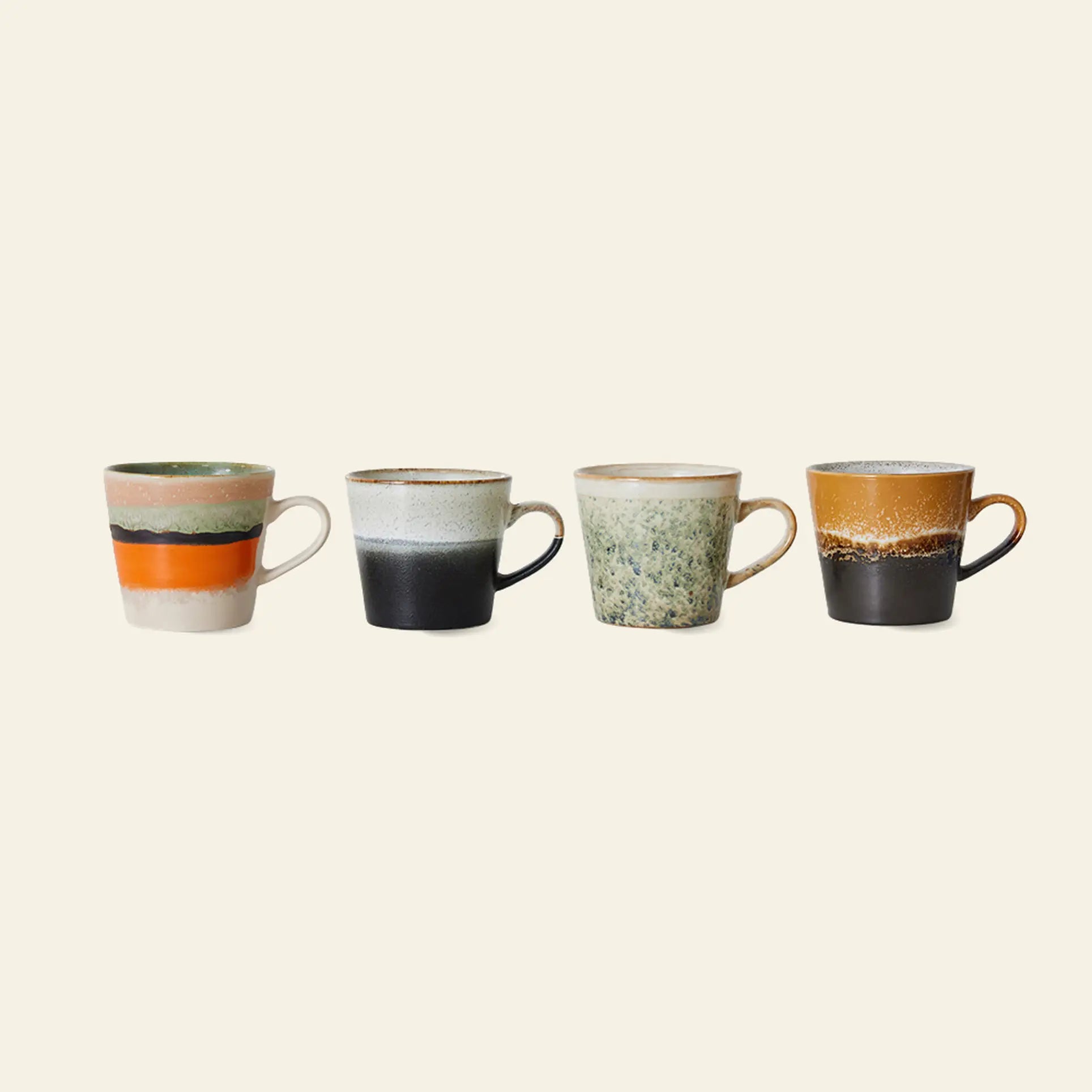 The HKLIVING 70s Ceramics: Cappuccino Mugs, Set of 4 features uniquely hand-glazed mugs with handles in retro stripes, speckles, and earthy tones, capturing vintage charm against a light backdrop.
