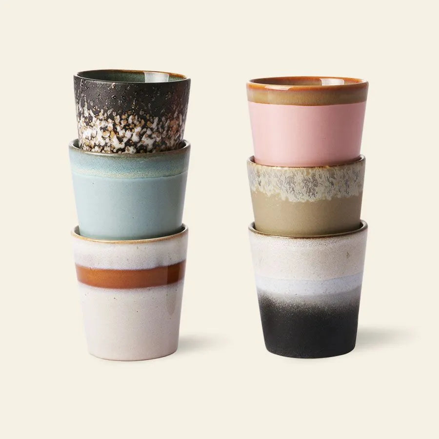 HKLIVING 70s Ceramics Coffee Mugs, Set of 6 by HKLIVING, showcased in two stacks of three, display earthy and pastel shades with unique handcrafted glazing, all set against a light beige background.
