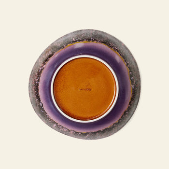The HKliving 70s Ceramics: Curry Bowls, Set of 2 feature a round form with a brown center, glossy purple ring, and textured gray edge—capturing vintage 70s flair—shown from above on a light beige background.