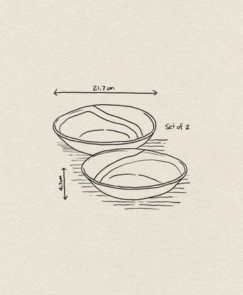 A simple line drawing of HKliving 70s Ceramics: Curry Bowls, Set of 2 by HKliving, each measuring 21.7 cm in diameter and 4.7 cm high, shown on a textured beige background.