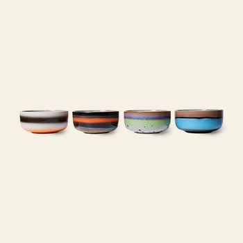 The HKLIVING 70s Ceramics Dessert Bowls set features four uniquely colored bowls—brown and white, dark brown with orange, green speckled, and blue with brown—each showcasing retro 70s design charm.