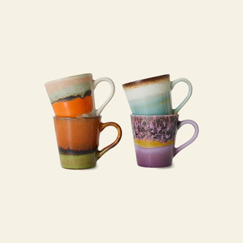 The HKLIVING 70s Ceramics: Espresso Mugs, Set of 4 features colorful, hand-painted mugs with unique multicolored designs and earthy tones, stacked in pairs against a plain background—classic style from the HKLIVING brand.