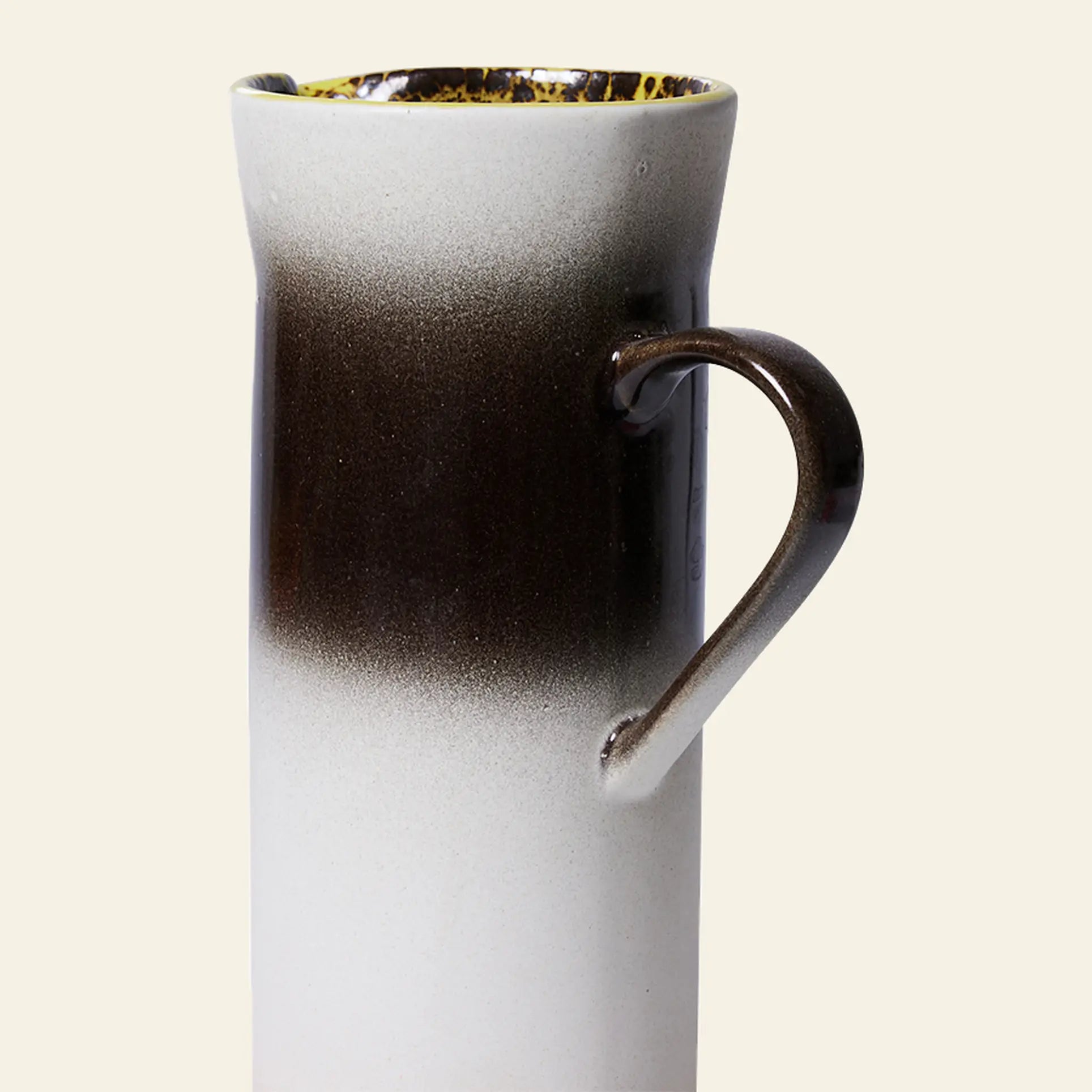 The HKLIVING 70s Ceramics: Jug - Bomb is a tall ceramic pitcher with a curved handle and a dark brown to white gradient, making it a modern accent inspired by 70s ceramics. Brand: HKLIVING.