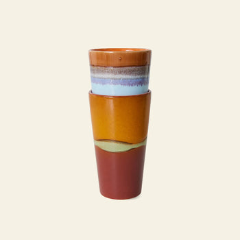 The HKLIVING 70s Ceramics: Latte Mugs, Set of 2, feature a glossy handcrafted glaze in earthy brown, blue, yellow, and red gradients—evoking retro stoneware charm—displayed on a beige background.