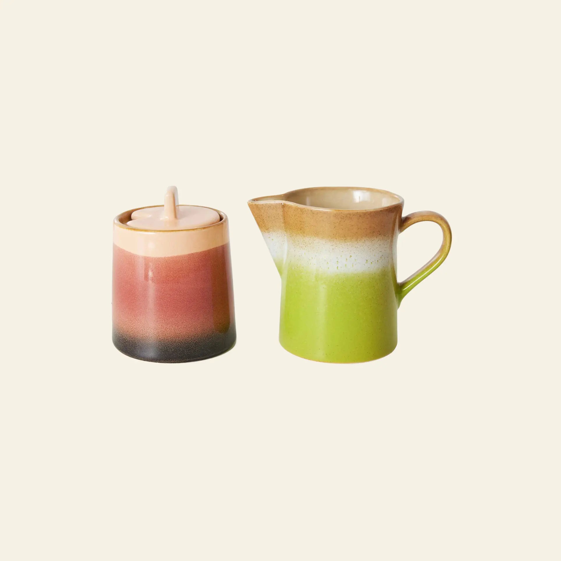 The HKLIVING 70s Ceramics Milk Jug & Sugar Pot set in Foreland combines glossy, gradient hues on classic forms, perfect for adding retro charm to your table.