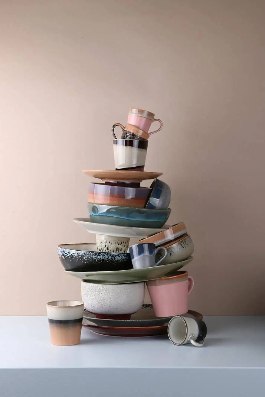 A set of four HKLIVING 70s Ceramics noodle bowls in assorted colors and patterns is displayed on a white surface with a beige background.