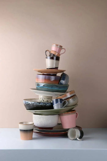 A set of four HKLIVING 70s Ceramics noodle bowls in assorted colors and patterns is displayed on a white surface with a beige background.