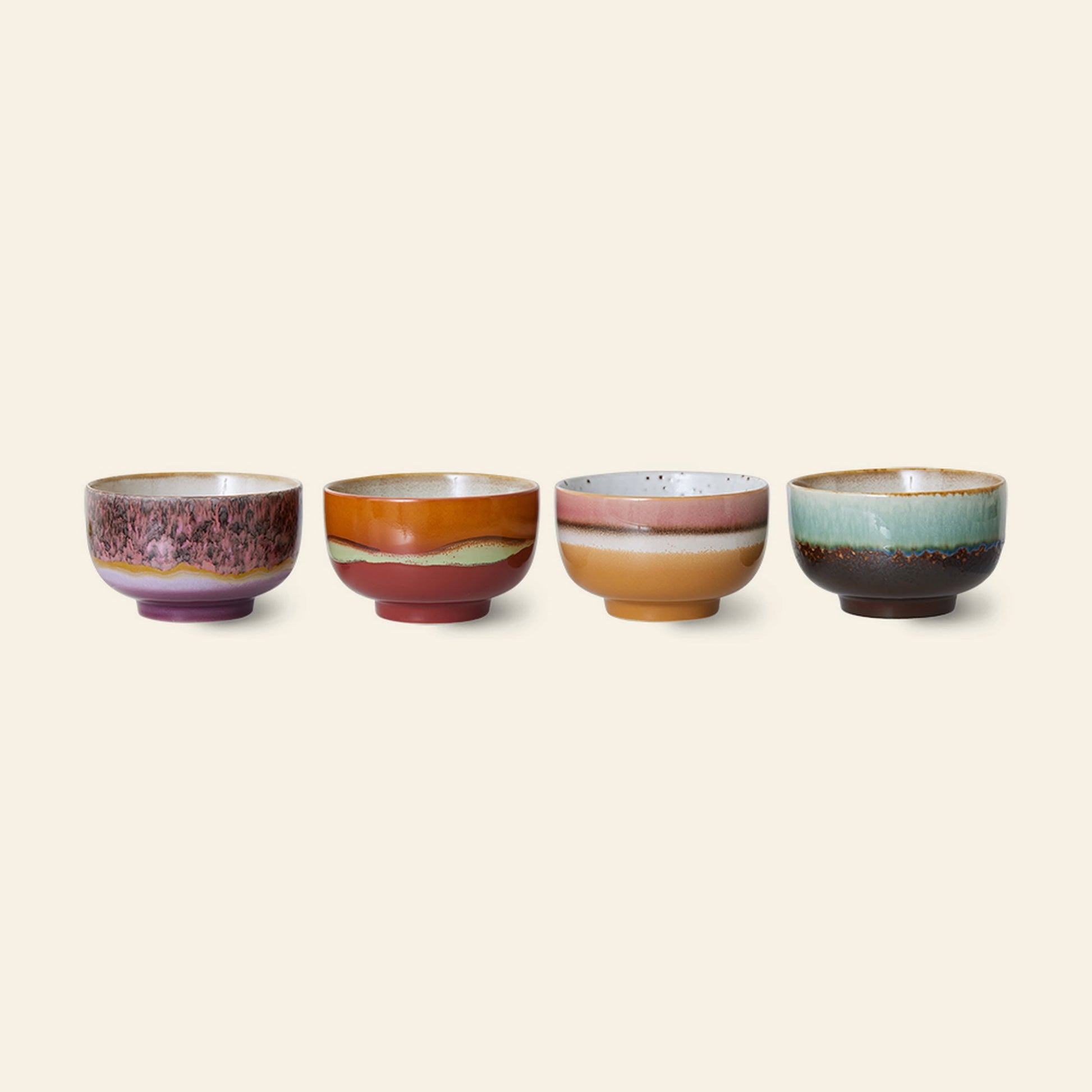 The HKLIVING 70s Ceramics: Noodle Bowls, Set of 4 features unique, colorful glazes in vibrant purple, orange, pink, green, and brown—each bowl showcasing a distinct retro-inspired design.