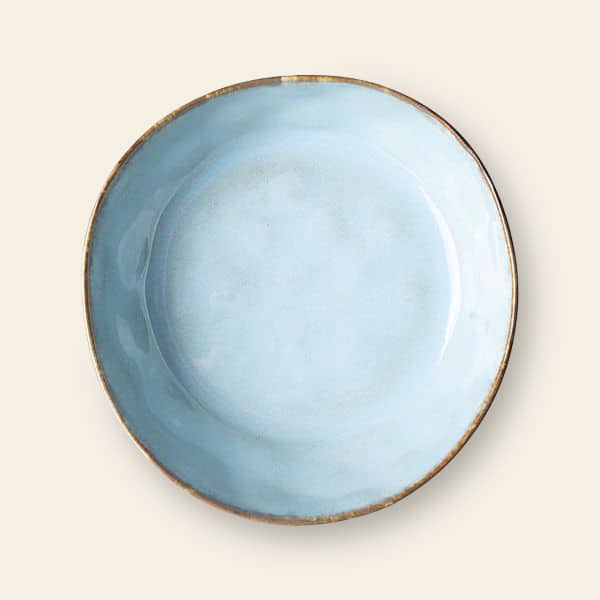 The HKliving 70s Ceramics: Pasta Bowls, Set of 2 features round, light blue ceramic bowls with a slightly uneven surface and rustic brown rims, ideal for an elegant table setting and shown on an off-white background.