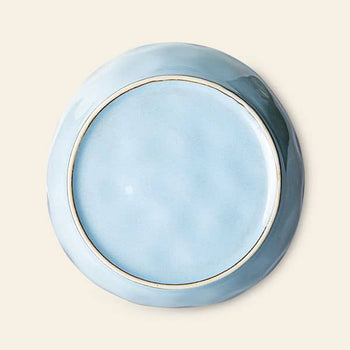 The HKliving 70s Ceramics: Pasta Bowls, Set of 2, are shown upside down on a plain background. These light blue ceramic bowls feature a glossy finish and a slightly raised rim—ideal for pasta or elegant table settings.