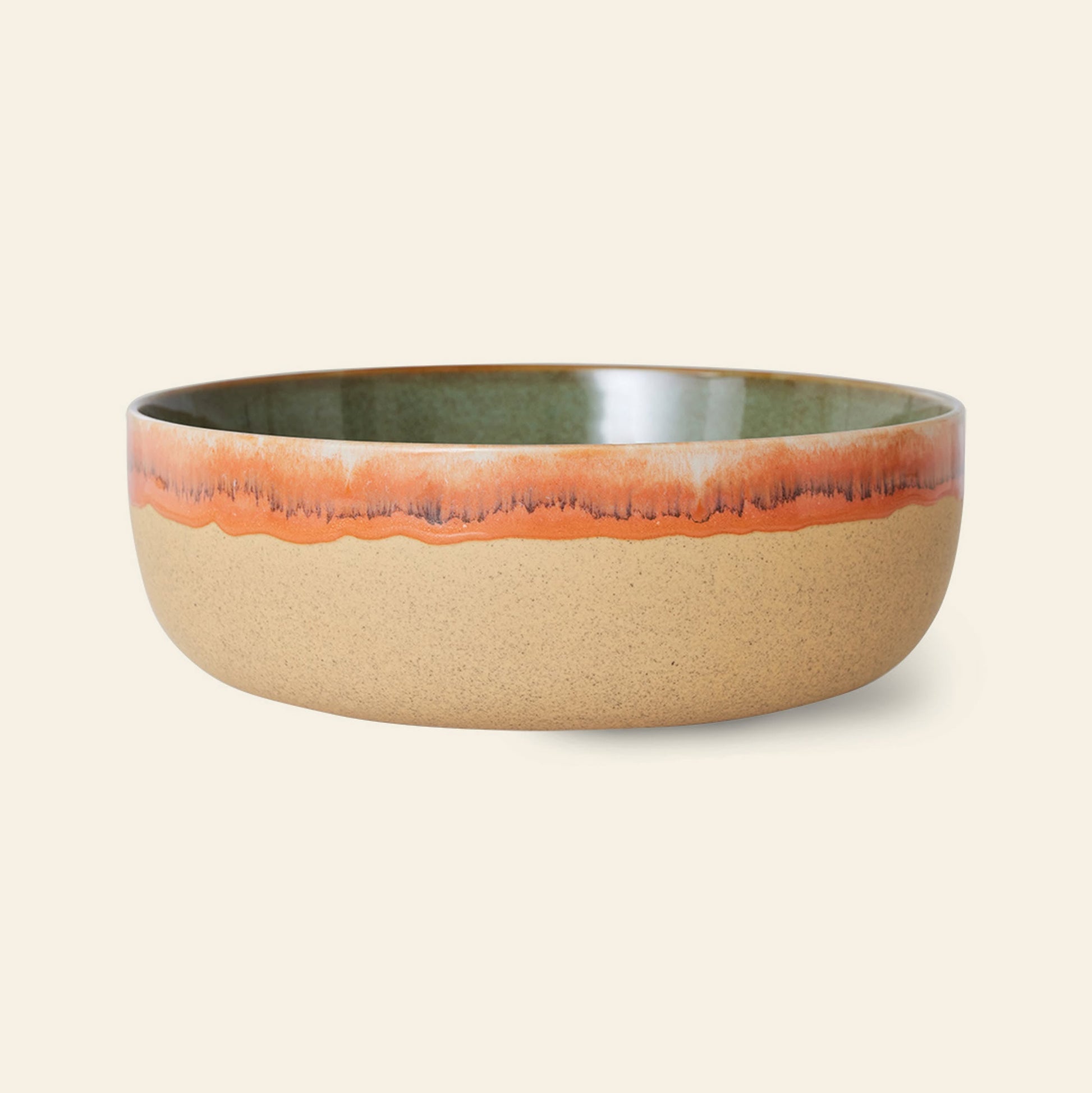 The HKLIVING 70s Ceramics: Salad Bowl features a natural unglazed beige base, a glossy green interior, and a wavy orange-red glazed rim with a subtle gradient, evoking classic '70s style.