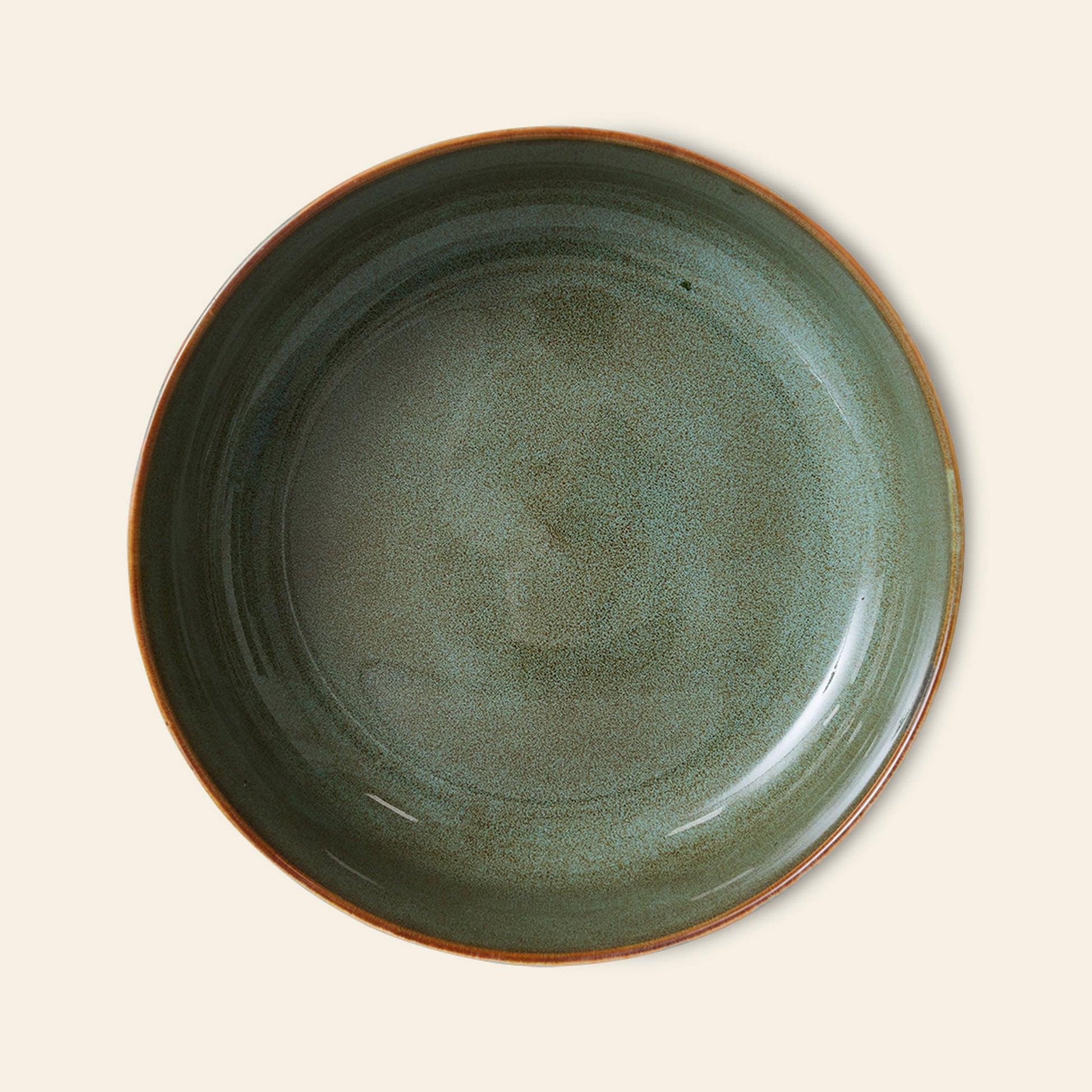 The HKLIVING 70s Ceramics: Salad Bowl features a glossy, speckled green ceramic finish with a brown rim, capturing retro charm. Presented on a light beige background.