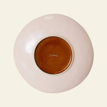 The HKLIVING 70s Ceramics: Side Plates, Set of 2, feature round ceramic plates with a soft pink rim and brown center, "irving" embossed in the middle—ideal for lovers of vintage style and 70s ceramics.