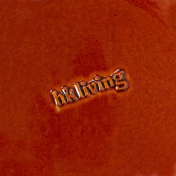 A close-up of the HKLIVING 70s Ceramics: Small Trays, Set of 2 - Twenty Four Hours shows an embossed HKLIVING logo at the center, with glossy reddish-brown glaze evoking vintage 70s ceramic style.