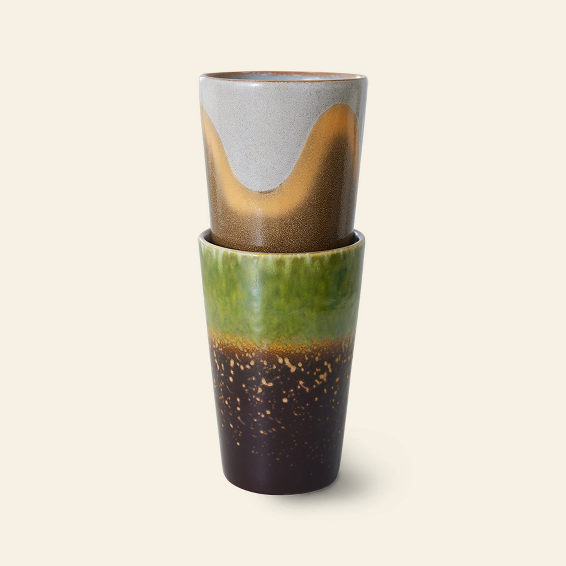 HKLIVING 70s Ceramics Tea Mugs, Set of 2, feature unique glaze designs: one with gray and tan waves, the other with green, brown, and speckles—adding retro style from HKLIVING to any plain background.
