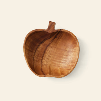 The HKLIVING Acacia Apple Bowl M by HKLIVING is a handcrafted bowl shaped like an apple with a short stem, made from sustainable acacia wood and shown against a plain light background.