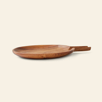 The HKLIVING Acacia Platter L is a round, shallow acacia wood platter with a short, flat handle, shown on a plain light background.