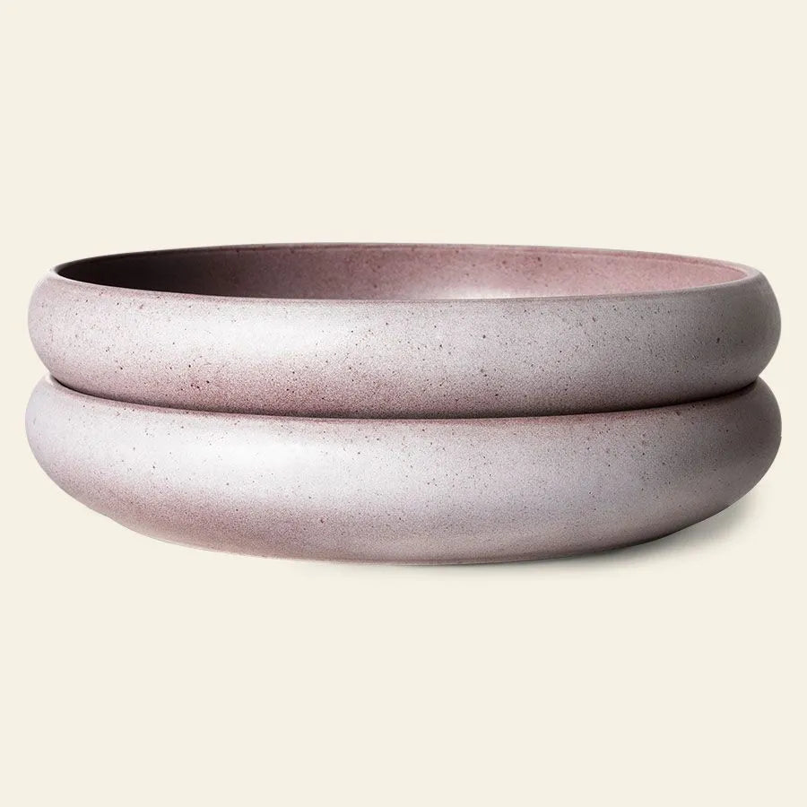 The HKLIVING Bold & Basic Ceramics Deep Plate, Set of 2, features round, minimalist ceramic bowls with a subtle pink hue and thick, raised rims, adding stylish elegance to any table setting.