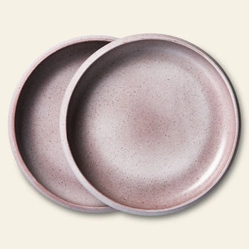 The HKLIVING Bold & Basic Ceramics Deep Plate Set of 2 features two round, pink speckled ceramic plates, stacked with one slightly overlapping the other, displayed on a light beige background.