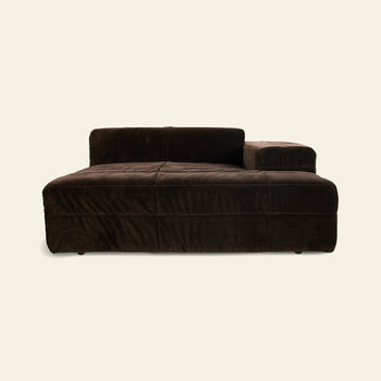 The HKLIVING Brut Sofa, Right Divan by HKLIVING is a plush dark brown velvet sculptural chaise lounge with a low backrest and wide right armrest, shown against a plain light background.
