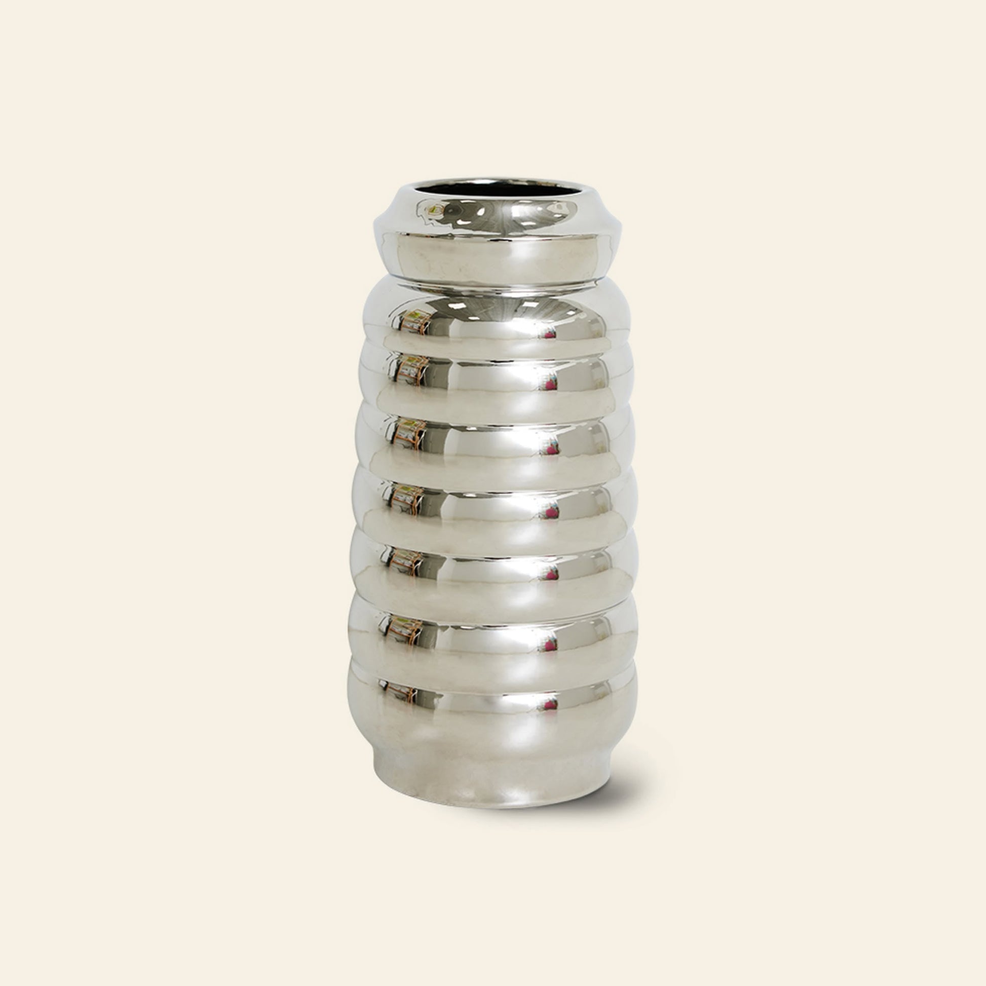 The HKLIVING Ceramic Ribble Vase features a shiny silver ribbed design with a rounded, cylindrical shape and mirrored finish, set against a light beige background—ideal for modern interiors.