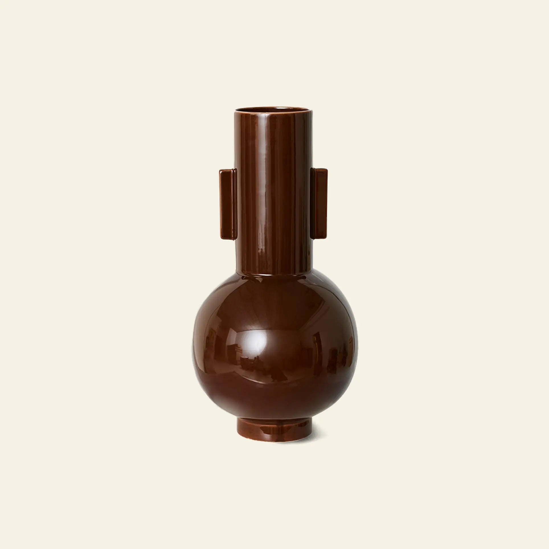 The HKLIVING Ceramic Vase L by HKLIVING features a glossy dark brown finish, round base, cylindrical neck, and two rectangular side handles. This large ceramic vase stands out against an off-white background.