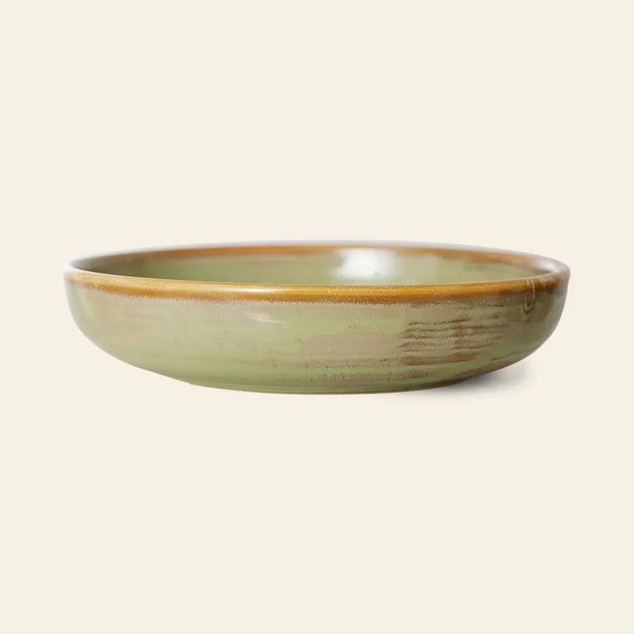 The HKLIVING Chef Ceramics: Deep Plate M features the brand’s signature hand-glazed ceramic style with a green glaze and brown rim, presented against a plain beige background.