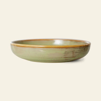 The HKLIVING Chef Ceramics: Deep Plate M features the brand’s signature hand-glazed ceramic style with a green glaze and brown rim, presented against a plain beige background.