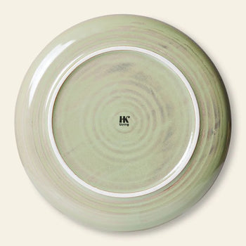 The HKLIVING Chef Ceramics: Dinner Plate is a round, light green ceramic plate with concentric circles and the HKLIVING logo on the base, featuring an artisanal glaze inspired by the Chef Ceramics collection.