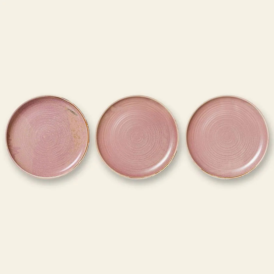Three HKLIVING Chef Ceramics Dinner Plates, round with a rustic pink artisanal glaze and subtle circular patterns, are arranged side by side on a light beige background.