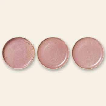 Three HKLIVING Chef Ceramics Dinner Plates, round with a rustic pink artisanal glaze and subtle circular patterns, are arranged side by side on a light beige background.