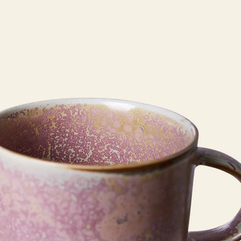 A close-up of the HKLIVING Chef Ceramics: Mug by HKLIVING, showcasing its speckled pink and beige glaze and rounded handle, set against a plain light background.