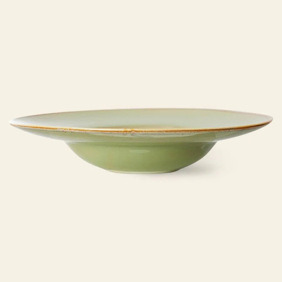 The HKLIVING Chef Ceramics Pasta Plate is a handcrafted, shallow and round light green ceramic plate with a slightly raised rim and subtle brown edge, shown against a plain beige background.