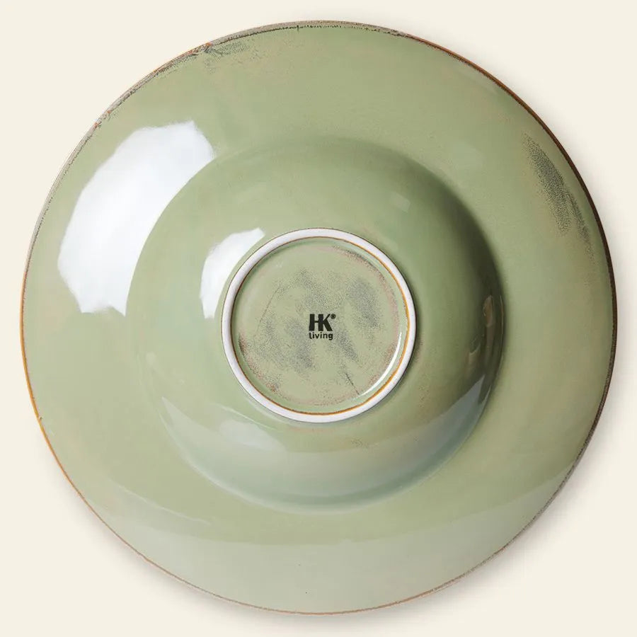 The HKLIVING Chef Ceramics: Pasta Plate features light green ceramic with a rustic, uneven finish, shown from the bottom with a white ring and HKLIVING logo in black, showcasing its artisanal craftsmanship.