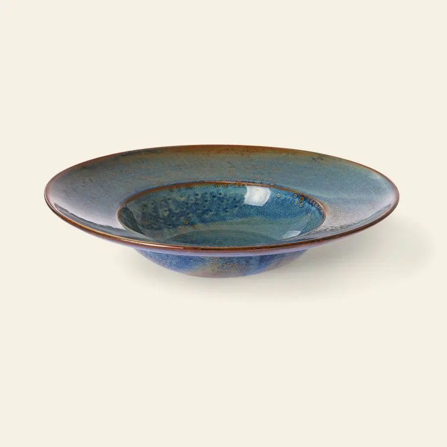 The HKLIVING Chef Ceramics Pasta Plate is a handcrafted, shallow round dish with a wide rim, glossy blue glaze, and brown-edged accents by HKLIVING, shown against a plain light background.