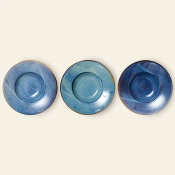 Three HKLIVING Chef Ceramics pasta plates, round and blue with a glazed finish, are arranged in a row against a light background. Each handcrafted plate by HKLIVING displays unique variations in shade and texture.