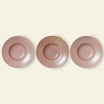 Three round, mauve ceramic plates from HKLIVING are arranged side by side on a light beige background. The center plate is the HKLIVING Chef Ceramics: Pasta Plate, handcrafted with a distinct texture and color pattern.