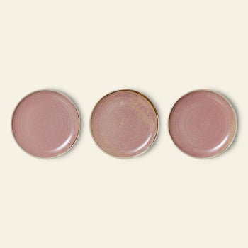 Three HKLIVING Chef Ceramics side plates, round and hand-glazed with a mauve-pink finish, are arranged in a horizontal row on a light beige background.