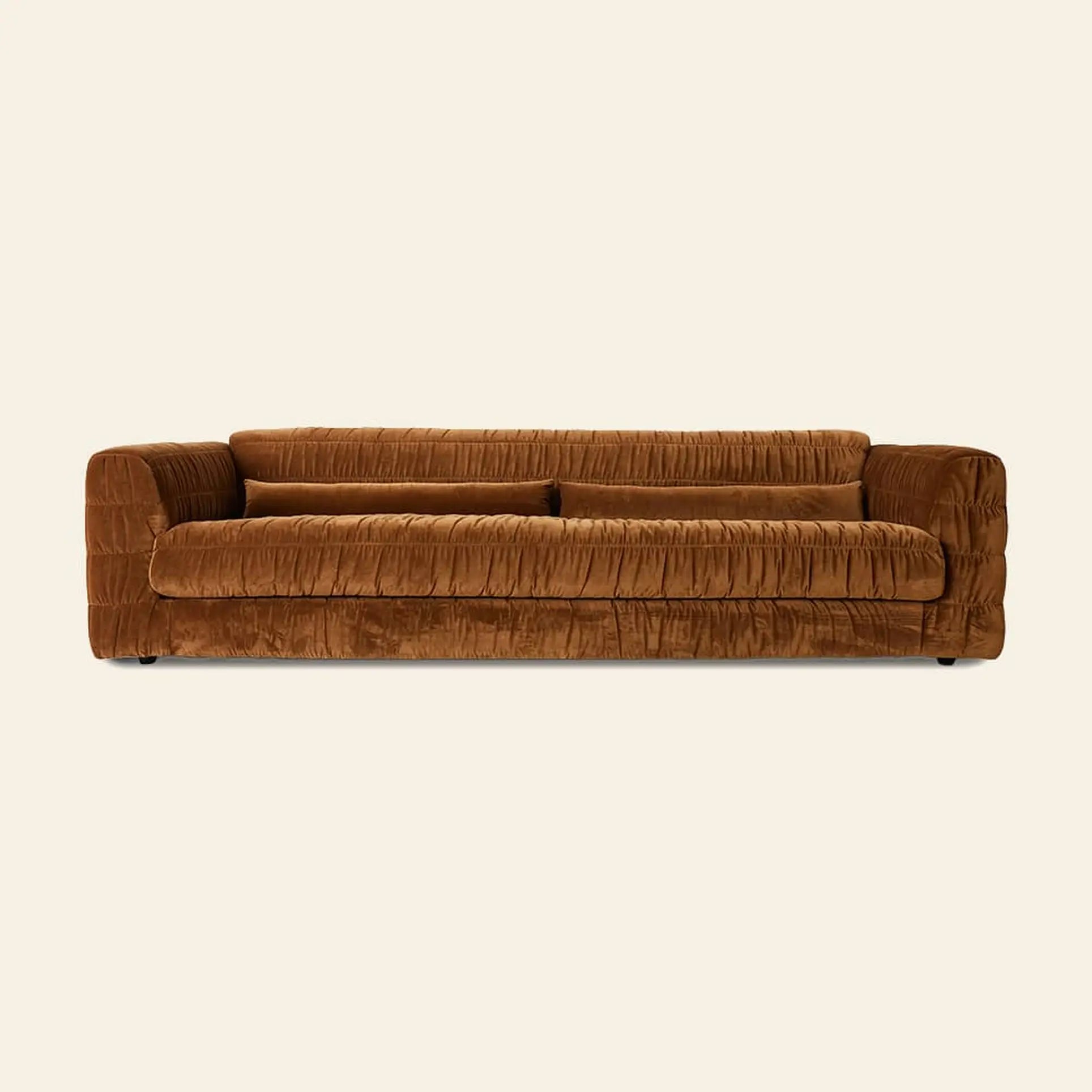 The HKLIVING Club Couch by HKLIVING is a brown velvet sofa with a low back and arms, showcasing ruched pleated upholstery, shown from the front against an off-white background.