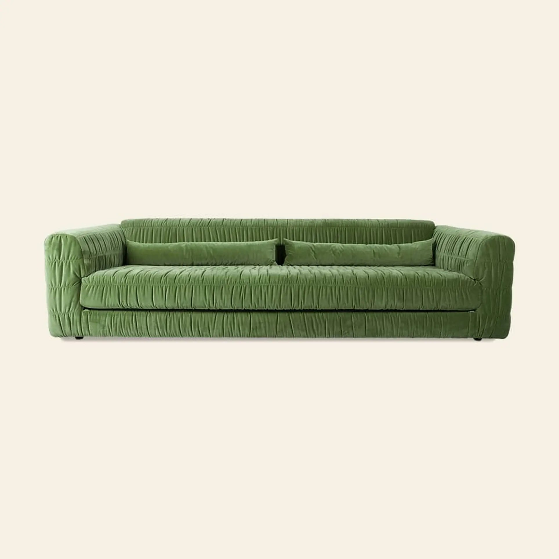 The HKLIVING Club Couch by HKLIVING features modern green pleated upholstery, a wrinkled fabric texture, low backrest, and wide armrests—an ideal statement piece for contemporary interiors.