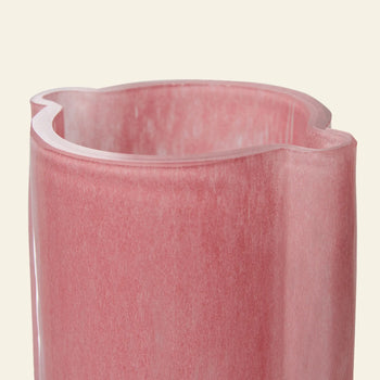 A close-up of the HKLIVING Glass Vase Flamingo Pink, featuring a wavy rim and translucent pink glass, set against a plain light background.
