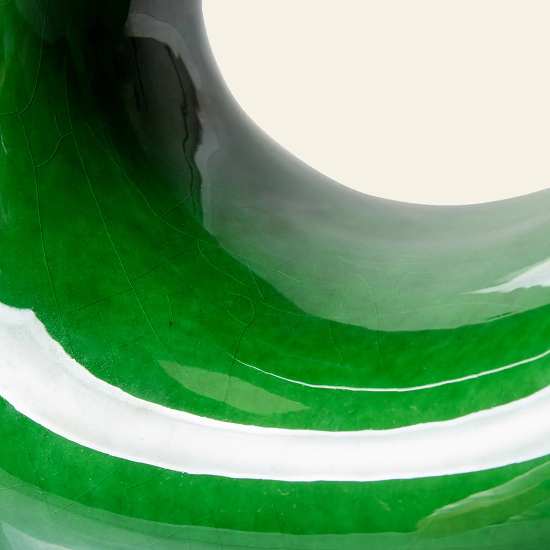Close-up of HKLIVING HK Objects: Ceramic Sculpture—glossy green ceramic with curved lines and reflections, creating a modern abstract pattern. Ideal as stylish green home decor by HKLIVING for contemporary interiors.
